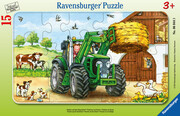 Traktor auf dem Bauernhof. Rahmenpuzzle 15 Teile